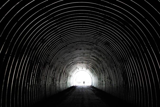 A bicyclist passes through the newly opened Pinkerton Tunnel on the Great Allegheny Passage in Upper Turkeyfoot Township, Pa., Oct. 26. (Gene J. Puskar/Associated Press)